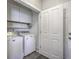 Functional laundry room with washer, dryer, and storage cabinets for added convenience at 120 Indigo Marsh Cir, Wando, SC 29492