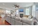 Bright living room with a fireplace, neutral paint, and a large sectional sofa at 120 Indigo Marsh Cir, Wando, SC 29492