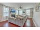 Bright living room with a fireplace, neutral paint, and a large sectional sofa at 120 Indigo Marsh Cir, Wando, SC 29492