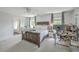 Bright main bedroom featuring a ceiling fan, large windows and carpeted floors at 120 Indigo Marsh Cir, Wando, SC 29492