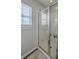 Shower features glass doors and tiled surround, located next to a window for natural light at 120 Indigo Marsh Cir, Wando, SC 29492