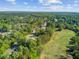Scenic aerial view of homes nestled among lush trees and a pristine golf course at 123 Dasharon Ln, Goose Creek, SC 29445