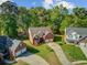 Aerial view of the property showcasing the brick home, driveway, and well-maintained landscaping at 123 Dasharon Ln, Goose Creek, SC 29445