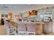 Stylish bar area with a full bar, pendant lighting, televisions, and seating at 123 Dasharon Ln, Goose Creek, SC 29445