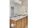 Bright bathroom with a wood vanity and a marble countertop and tile floors at 123 Dasharon Ln, Goose Creek, SC 29445