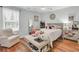 Bright bedroom with a ceiling fan, hardwood floors, a neutral color palette, and a comfortable sitting area at 123 Dasharon Ln, Goose Creek, SC 29445