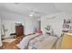 Cozy bedroom with hardwood floors, dresser with TV and light walls and white trim at 123 Dasharon Ln, Goose Creek, SC 29445