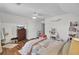 Well-lit bedroom featuring wood floors, a ceiling fan, dresser, and white makeup table at 123 Dasharon Ln, Goose Creek, SC 29445