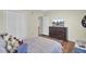 Cozy bedroom with wood floors, a television on a dresser, and bright white trim at 123 Dasharon Ln, Goose Creek, SC 29445