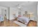 Bright bedroom featuring a ceiling fan, wood floors, and natural light from a window at 123 Dasharon Ln, Goose Creek, SC 29445