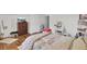 Inviting bedroom featuring wood floors, a dresser with a TV and light walls and white trim at 123 Dasharon Ln, Goose Creek, SC 29445