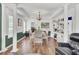 Bright dining room featuring elegant columns, hardwood floors, and a stylish chandelier at 123 Dasharon Ln, Goose Creek, SC 29445