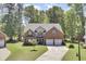 Charming two-story brick home with a well-manicured lawn and a two-car garage at 123 Dasharon Ln, Goose Creek, SC 29445
