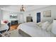 This bright main bedroom features a tray ceiling, an ornamental chandelier, and calming paint tones at 123 Dasharon Ln, Goose Creek, SC 29445