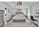 This primary bedroom features a tray ceiling, a ceiling fan, a large bed, and an ensuite bathroom at 123 Dasharon Ln, Goose Creek, SC 29445