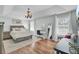 Serene main bedroom with hardwood floors, a decorative chandelier, and ample natural light at 123 Dasharon Ln, Goose Creek, SC 29445