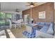 Spacious screened-in porch featuring a dining area and a comfortable seating area, ideal for outdoor entertaining at 123 Dasharon Ln, Goose Creek, SC 29445