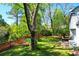 Private backyard oasis with a pond view, a red fence, and patio seating at 1255 Horseshoe Bnd, Mount Pleasant, SC 29464