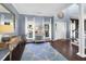 Inviting foyer with a blue starfish rug, stylish decor and natural light streaming through the windows at 1255 Horseshoe Bnd, Mount Pleasant, SC 29464