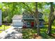 Charming two-story home with a front porch, attached garage, and lush green lawn at 1255 Horseshoe Bnd, Mount Pleasant, SC 29464