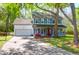 Charming two-story home featuring a welcoming front porch and manicured lawn at 1255 Horseshoe Bnd, Mount Pleasant, SC 29464