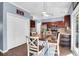 Eat-in kitchen featuring a wooden dining table, white chairs, and modern appliances at 1255 Horseshoe Bnd, Mount Pleasant, SC 29464