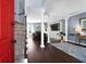 Open-concept living area with hardwood floors, columns, and staircase at 1255 Horseshoe Bnd, Mount Pleasant, SC 29464
