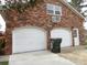 Garage with two doors and a trash can at 136 Tall Pines Rd, Ladson, SC 29456