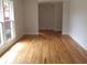 Sunlit living room featuring gleaming hardwood floors and neutral paint at 136 Tall Pines Rd, Ladson, SC 29456