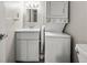 Efficient bathroom setup with stacked washer and dryer and vanity at 14 Lockwood Dr # 6E, Charleston, SC 29401