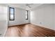 Well-lit bedroom boasts wood floors, two large windows, and a neutral color palette at 14 Lockwood Dr # 6E, Charleston, SC 29401