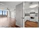 Living room and kitchen area, with hardwood floors, a fan and a harbor view at 14 Lockwood Dr # 6E, Charleston, SC 29401