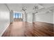 Spacious living room featuring hardwood floors, large windows, ceiling fans and mirrored wall at 14 Lockwood Dr # 6E, Charleston, SC 29401