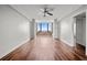 Bright living room with hardwood floors, a ceiling fan, and built-in shelving at 14 Lockwood Dr # 6E, Charleston, SC 29401