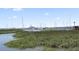 Picturesque marina view with numerous boats and sailboats docked on a sunny day at 14 Lockwood Dr # 6E, Charleston, SC 29401