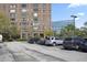 Exterior shot of a building and the adjacent parking lot with parked vehicles at 14 Lockwood Dr # 6E, Charleston, SC 29401