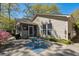Backyard with patio, screened porch, and mature trees at 1411 River Front Dr, Charleston, SC 29407