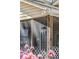 Screened-in porch detail with exterior wind chimes and lattice at 1411 River Front Dr, Charleston, SC 29407