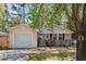 Charming single-story home with vinyl siding, an attached garage, and a well-maintained front yard with flowers at 1411 River Front Dr, Charleston, SC 29407