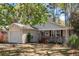 Well-maintained single-story home with vinyl siding, an attached garage, and a landscaped front yard at 1411 River Front Dr, Charleston, SC 29407