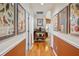 Inviting hallway featuring hardwood floors and stylish decor at 1411 River Front Dr, Charleston, SC 29407