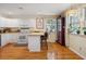 Inviting kitchen with white cabinets, stainless steel appliances, and a breakfast bar, perfect for casual dining at 1411 River Front Dr, Charleston, SC 29407