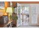 Open white doors leading from the living room to the outdoor screened-in porch at 1411 River Front Dr, Charleston, SC 29407