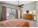 The main bedroom has carpet, ceiling fan, dresser, ensuite, closet and windows at 1411 River Front Dr, Charleston, SC 29407