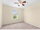 Bright bedroom with carpeted floors, neutral walls, and natural light at 143 Basket Grass Ln, Summerville, SC 29486