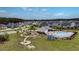 An aerial view of a neighborhood park featuring a community pool, playground and fire pit at 143 Basket Grass Ln, Summerville, SC 29486