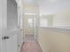 Bright hallway featuring neutral walls, carpet, and multiple entryways at 143 Basket Grass Ln, Summerville, SC 29486