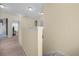 Bright hallway with neutral tones and carpet flooring connects various rooms on the upper level at 143 Basket Grass Ln, Summerville, SC 29486