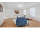 Bright living room with wood-look floors, comfortable seating, and a wall-mounted TV at 143 Basket Grass Ln, Summerville, SC 29486