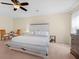 Spacious main bedroom with ceiling fan, neutral paint, carpet flooring, and ample natural light at 143 Basket Grass Ln, Summerville, SC 29486